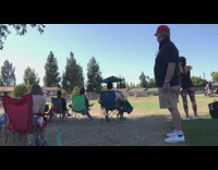 Old man really into soccer game of kids