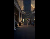 Woman fur coat poses inside the museum