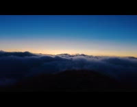 Time lapse rolling clouds on mountain and horizon