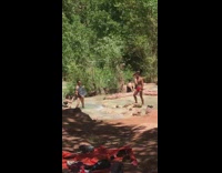 Guy flexes by waterfall light reflector pt. 2