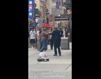 Two guys get into fight suit sidewalk 