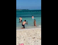 Woman bikini kneel for photo at beach