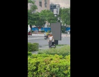 Woman in a white crop top tiktok dance at the sidewalk