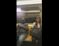 Collab Subway Creatures - Woman blue shirt on left smiles at her phone on subway train