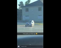 Little car on street waiting for light 