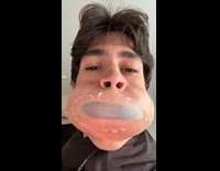 Man tries to blow air with sleep strip mouth cover 