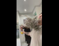 Guy pours orange juice on floor and gets hit in face with wet mop