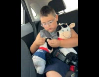 Collab BitchMP - Kid holds two cow plushies and made a middle finger gesture