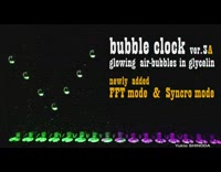 Glowing air bubble clock synced with piano