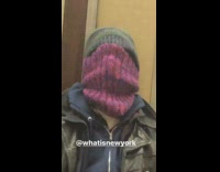 Lady with purple scarf over face subway 