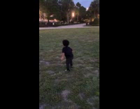 Kid Plays Catch Ball with Man in Park