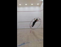 Guy spins and falls inside spinning hoop