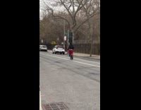 Man riding bike balance fridge on head