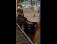 Line of parked cars with parking tickets