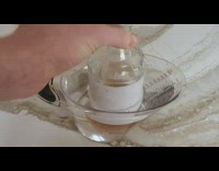 Person put bottle in pitcher with water