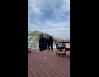 Women black outfit tiktok dance at balcony