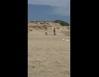 Man shirtless white shorts grabs crotch beach photoshoot