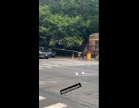 Man begs money holds stick with cup
