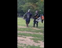 2 medieval soliders fight at park 