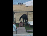 Woman red bikini lay down fake grass