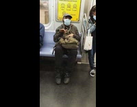 Black jacket guy moves hand finger subway 