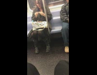 woman rolls joint on brown bag with words