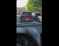 Red jeep with tired RN license plate 