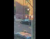 Woman white top umbrella sidewalk graffiti sunset