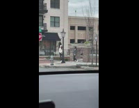 Girl white hoodie bend knee stop sign