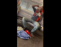 Guy unties knot in red hair train 