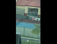 Two girls three jump shot tennis racket