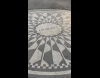 Woman sings Imagine at Strawberry Fields 