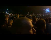 Men sit do row movement at concert