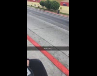 Woman driving forklift down road