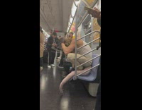 Rat guy hangs upside down on ceiling bar 