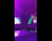nsfw music girl grabbing on to cop while on stage