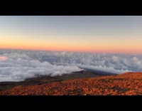 Sunset and clouds on top of mountain