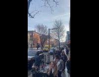 Man ride bike with tire on head