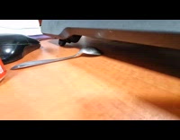 Rat underneath grabs the spoon on table