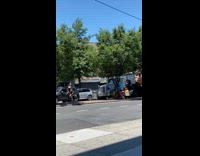Illegally parked car blocks truck driving who is angry
