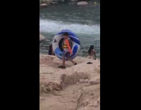 Collab IITW - Woman bikini sits by the rapid river