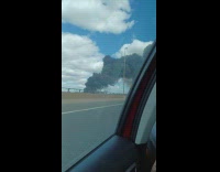 Black smoke cloud from fire car highway