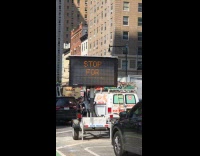 Man reacts at malfunctioning digital road sign 