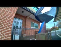 Blue canopy blown away by strong wind