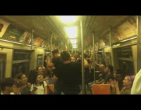 Woman bends over and throws up on the floor on subway train