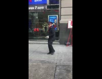 Salvation army guy dances outside for donations with bell