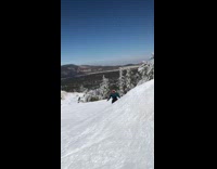 Guy attempts front flip snowboard red ramp