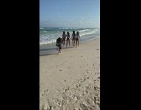 Girls wear matching clothes to beach