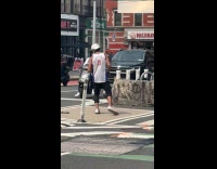 Guy practice kickboxing in middle of road