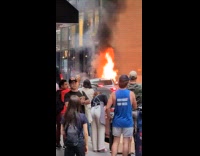 Collab WINY - People look at car burn on street